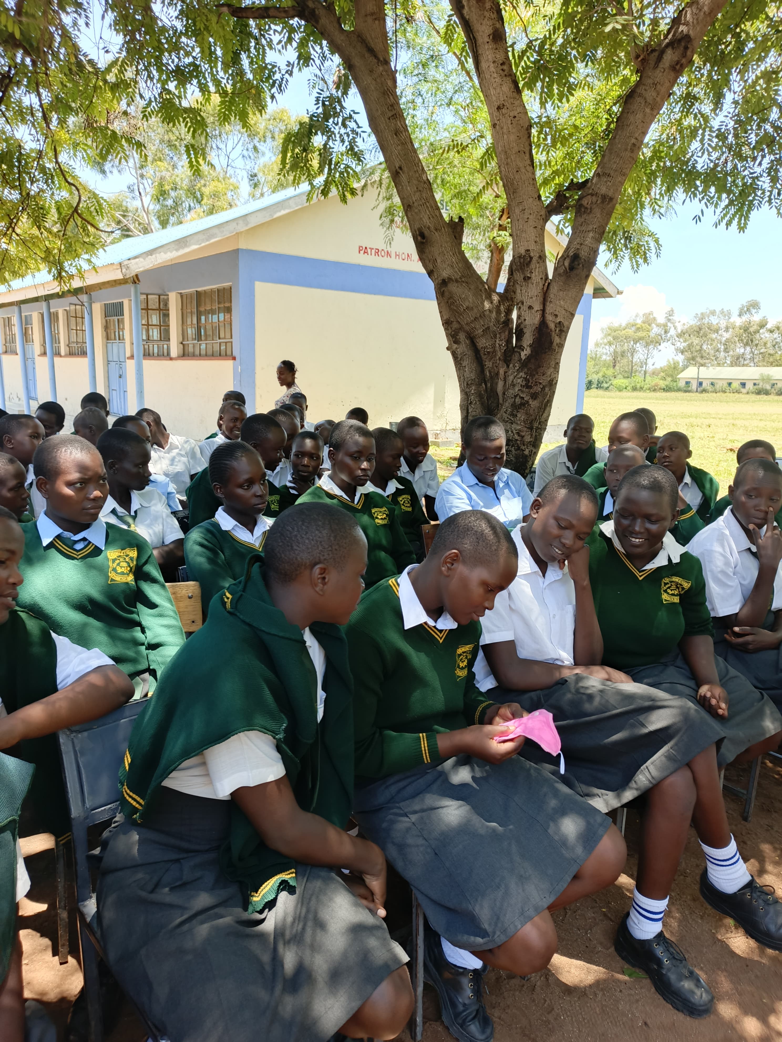 Young Kenyan girl smiling and looking hopeful